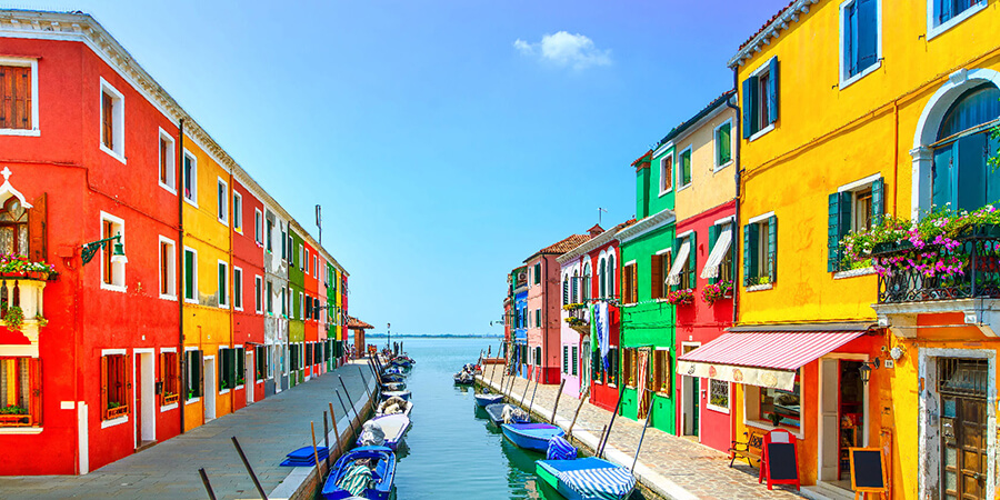 Brightly coloured buildings near a canal