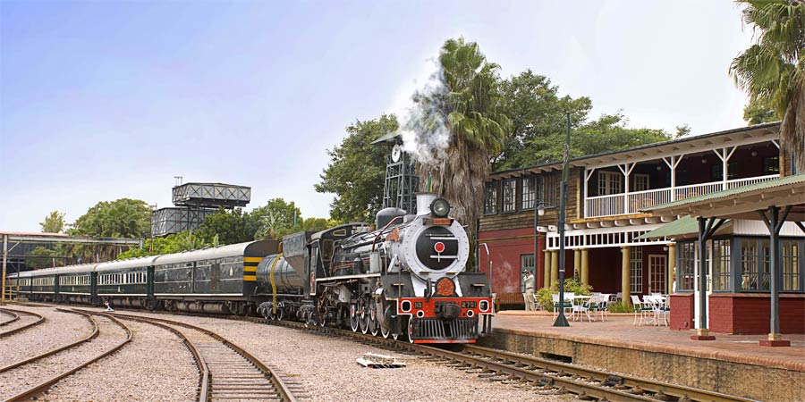 Zimbabwe. Victoria Falls. Steam train. Man looking out of window