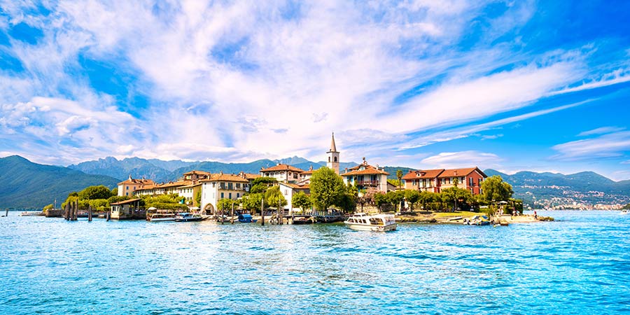 A small fisherman’s island sits upon the bright blue waters of Lake Maggiore.