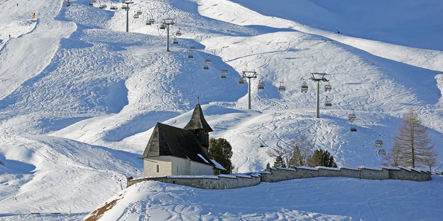 Admire the scenery on a beautiful train journey to a lakeside mountain town
