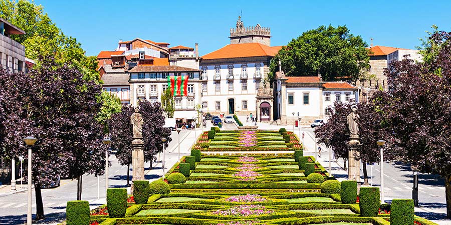 A perfectly manicured garden of hedges and flowers runs through the middle of the picturesque town of Guimaraes.