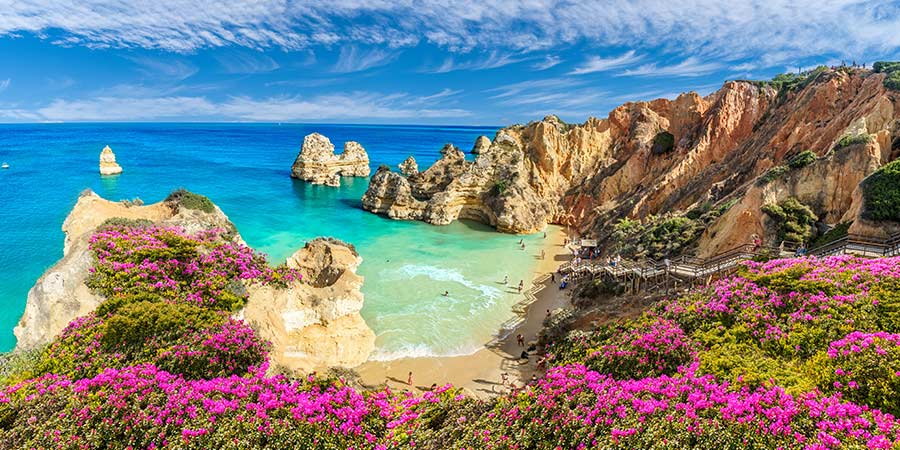 Praia do Camilo is a beautiful tranquil beach of Algarve, with its classic rocky yellow cliff faces and bright blue seas.