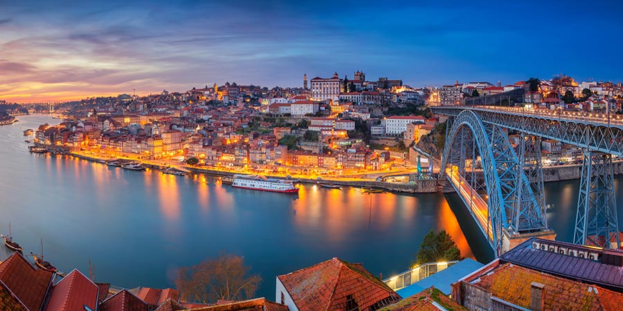 Panoramic cityscape image of Porto, Portugal with the famous Luis.