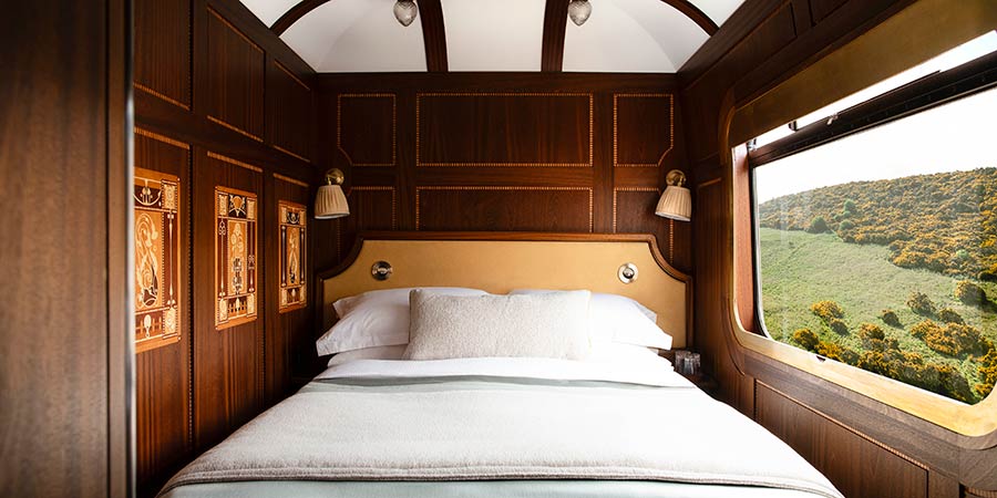 The beautiful cabin onboard the Royal Scotsman is decorated with ornate wood panelling.