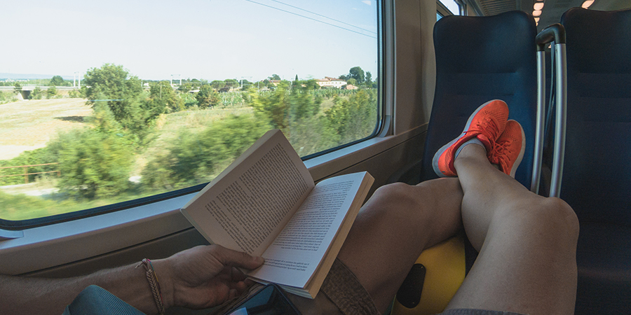 Lying on the seat of a passenger train Lying on the seat of a passenger train
